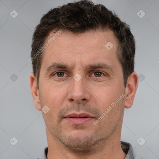 Neutral white adult male with short  brown hair and brown eyes