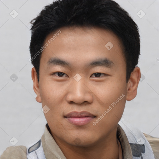 Joyful asian young-adult male with short  black hair and brown eyes