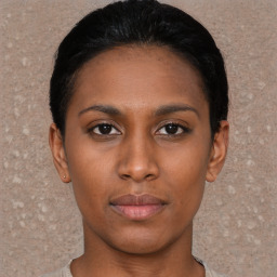 Neutral black young-adult female with short  black hair and brown eyes