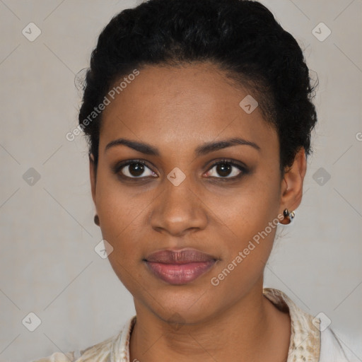 Joyful black young-adult female with short  black hair and brown eyes