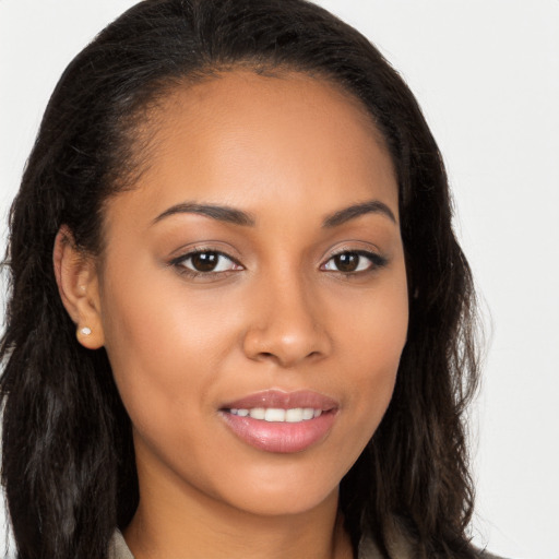 Joyful latino young-adult female with long  brown hair and brown eyes