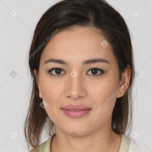 Joyful latino young-adult female with medium  brown hair and brown eyes