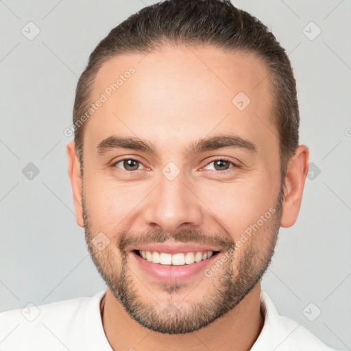 Joyful white young-adult male with short  brown hair and brown eyes