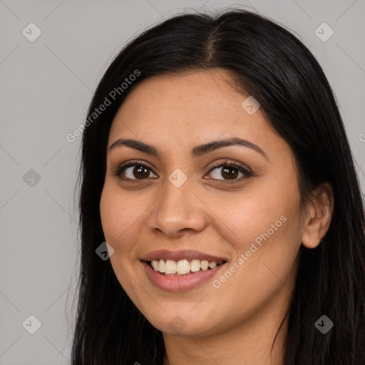 Joyful latino young-adult female with long  brown hair and brown eyes