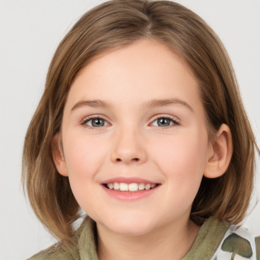 Joyful white child female with medium  brown hair and grey eyes