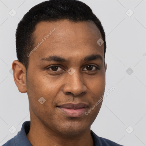 Joyful black young-adult male with short  brown hair and brown eyes