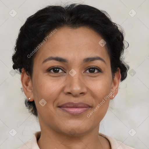 Joyful latino adult female with short  brown hair and brown eyes