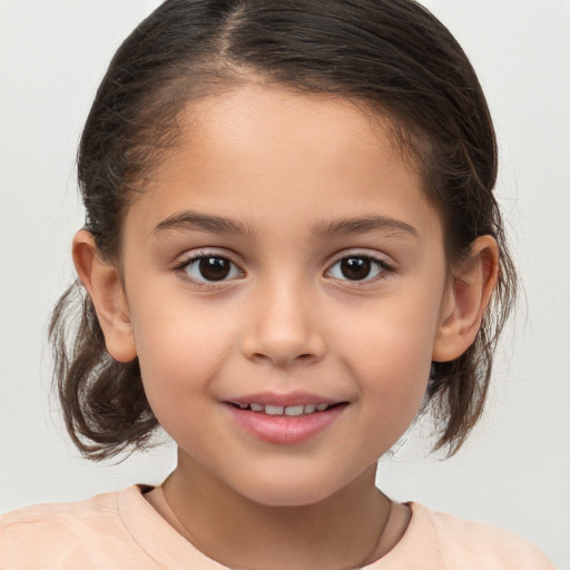 Joyful white child female with medium  brown hair and brown eyes