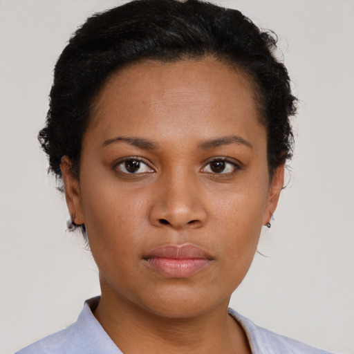 Neutral black young-adult female with short  brown hair and brown eyes