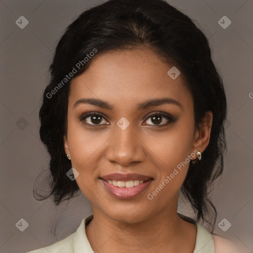 Joyful black young-adult female with long  brown hair and brown eyes