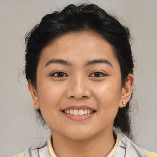 Joyful asian young-adult female with medium  brown hair and brown eyes