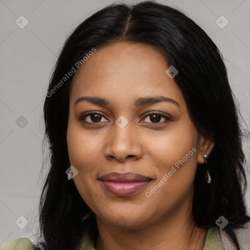 Joyful black young-adult female with long  black hair and brown eyes