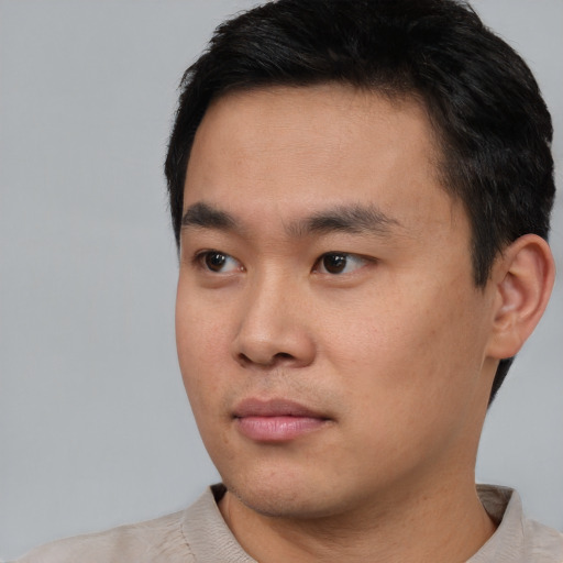 Neutral asian young-adult male with short  black hair and brown eyes