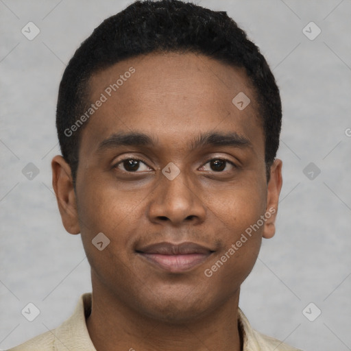 Joyful black young-adult male with short  black hair and brown eyes