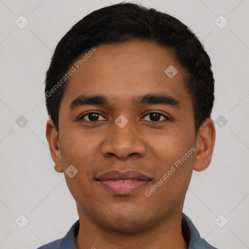 Joyful latino young-adult male with short  black hair and brown eyes