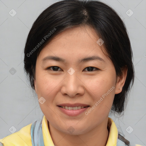 Joyful asian young-adult female with medium  brown hair and brown eyes