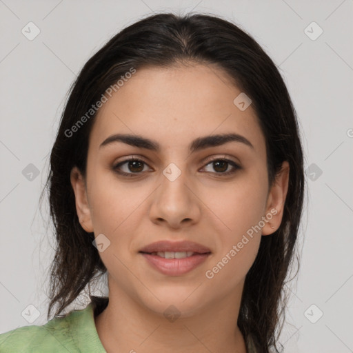 Joyful latino young-adult female with medium  brown hair and brown eyes