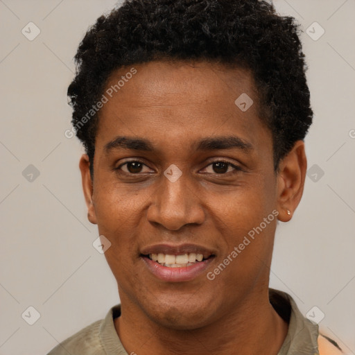 Joyful black young-adult male with short  black hair and brown eyes