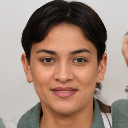 Joyful white young-adult female with medium  brown hair and brown eyes