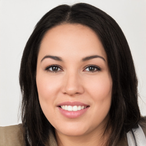 Joyful white young-adult female with long  black hair and brown eyes