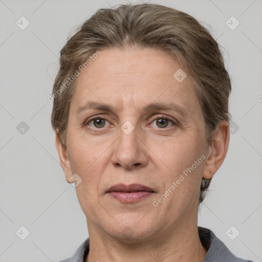 Joyful white adult female with short  brown hair and grey eyes