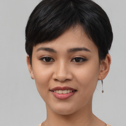 Joyful asian young-adult female with short  black hair and brown eyes