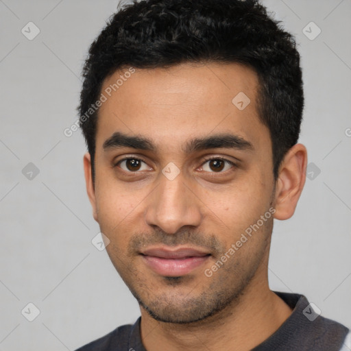 Joyful latino young-adult male with short  black hair and brown eyes