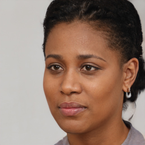 Neutral black young-adult female with short  black hair and brown eyes