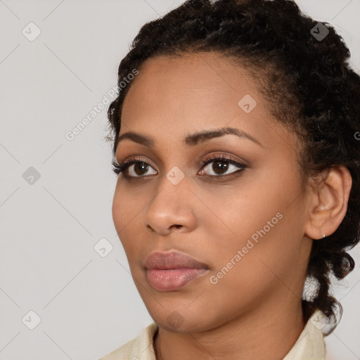 Neutral black young-adult female with medium  brown hair and brown eyes