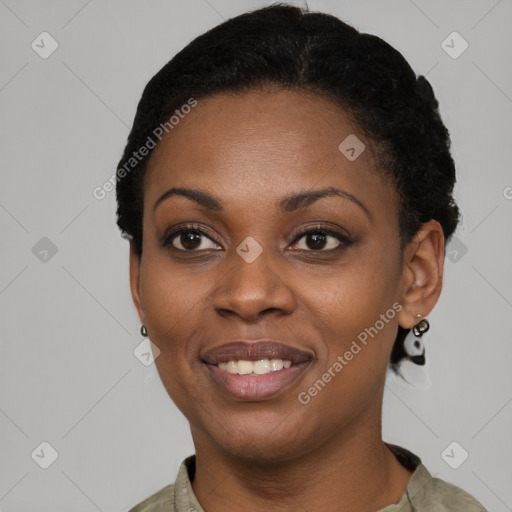 Joyful black young-adult female with short  black hair and brown eyes