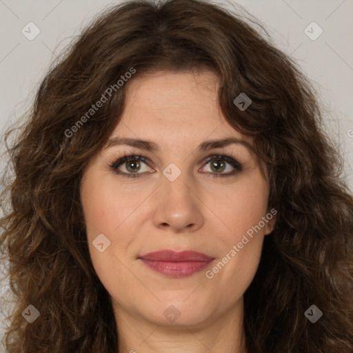 Joyful white adult female with long  brown hair and brown eyes