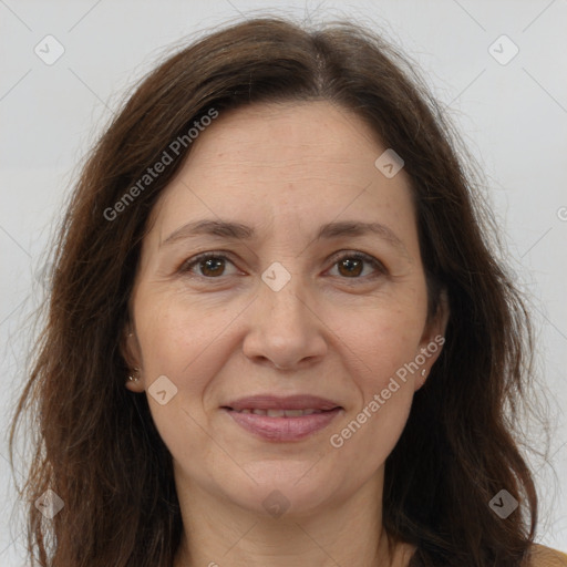 Joyful white adult female with long  brown hair and brown eyes