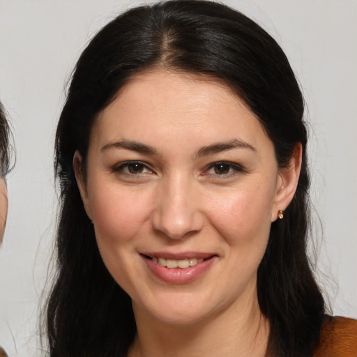 Joyful white young-adult female with medium  brown hair and brown eyes