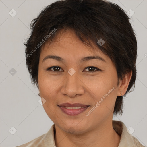 Joyful asian adult female with medium  brown hair and brown eyes