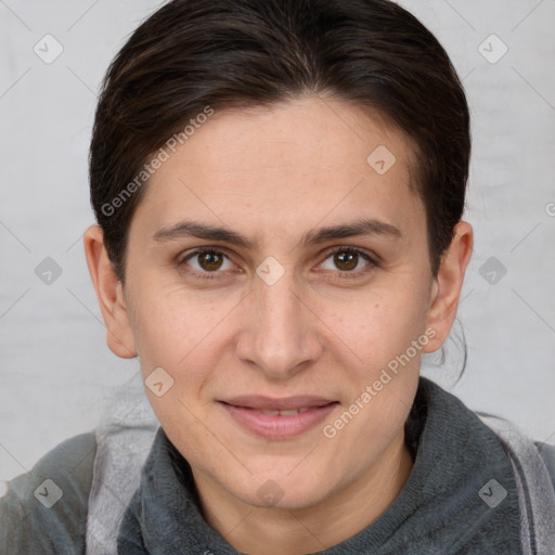 Joyful white adult female with medium  brown hair and brown eyes