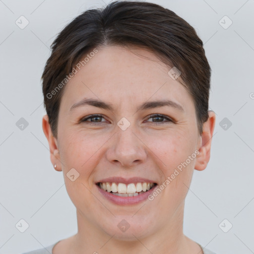 Joyful white young-adult female with short  brown hair and brown eyes