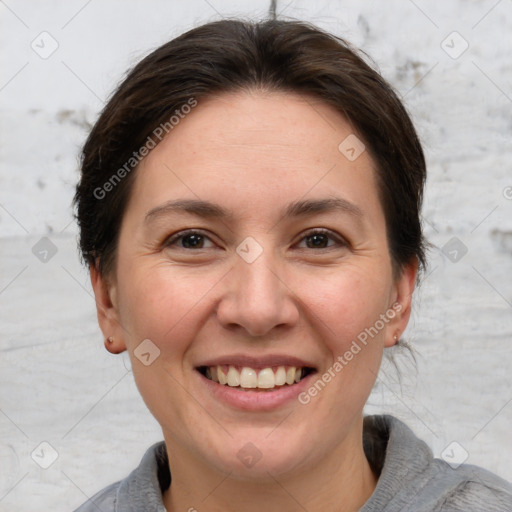 Joyful white adult female with short  brown hair and brown eyes