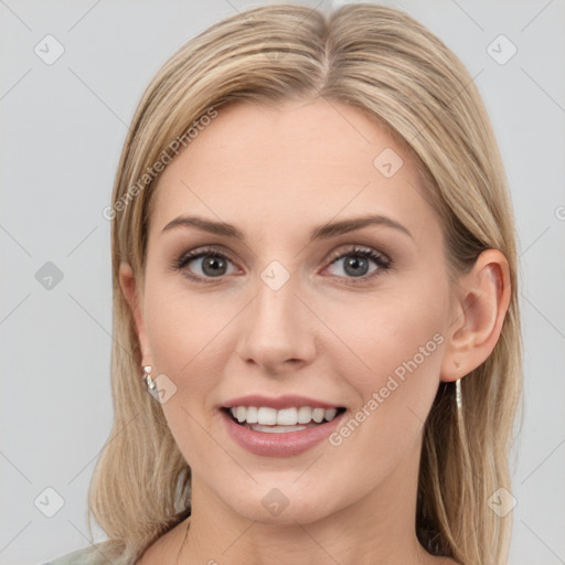 Joyful white young-adult female with medium  brown hair and grey eyes