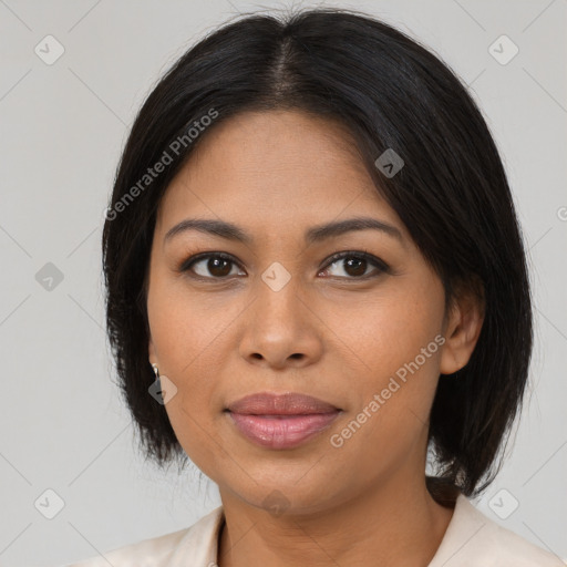 Joyful latino young-adult female with medium  brown hair and brown eyes