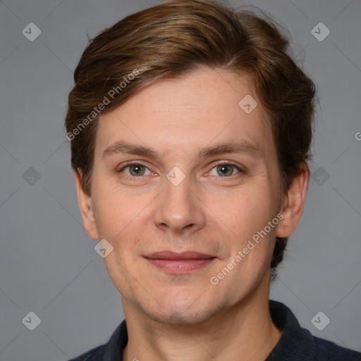 Joyful white adult male with short  brown hair and grey eyes