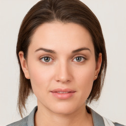 Neutral white young-adult female with medium  brown hair and brown eyes