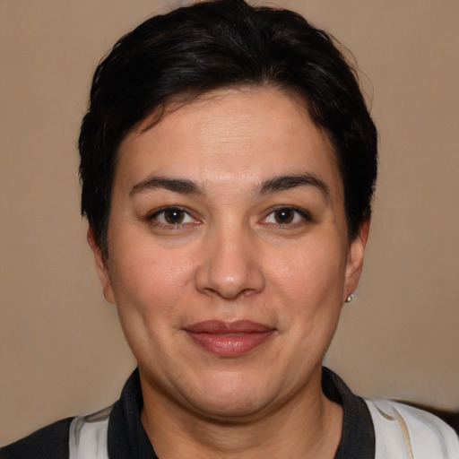 Joyful white young-adult female with short  black hair and brown eyes