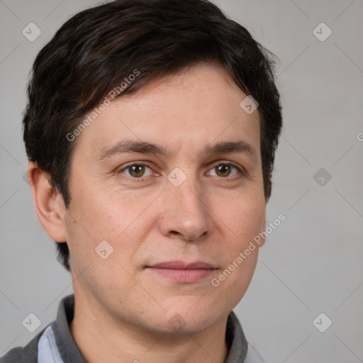 Joyful white adult male with short  brown hair and brown eyes