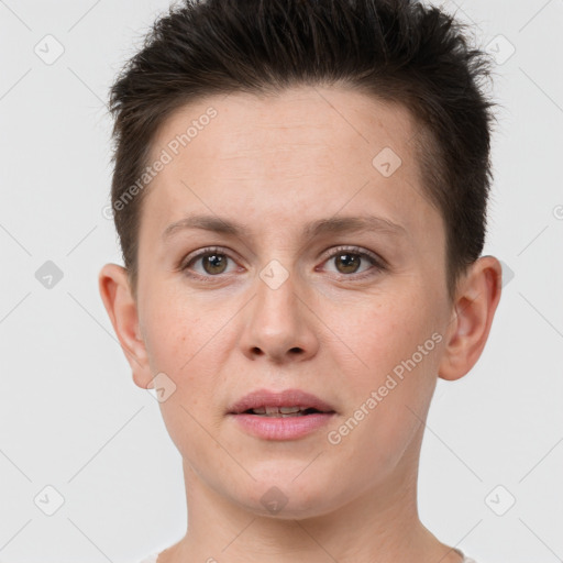 Joyful white young-adult female with short  brown hair and grey eyes