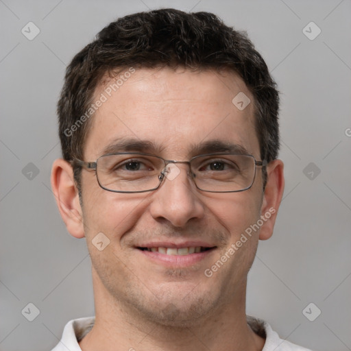 Joyful white adult male with short  brown hair and brown eyes