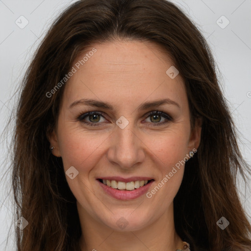 Joyful white adult female with long  brown hair and brown eyes