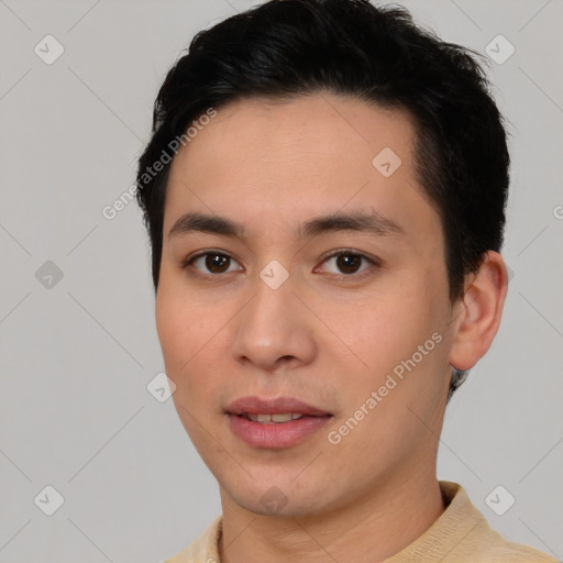 Joyful white young-adult male with short  black hair and brown eyes