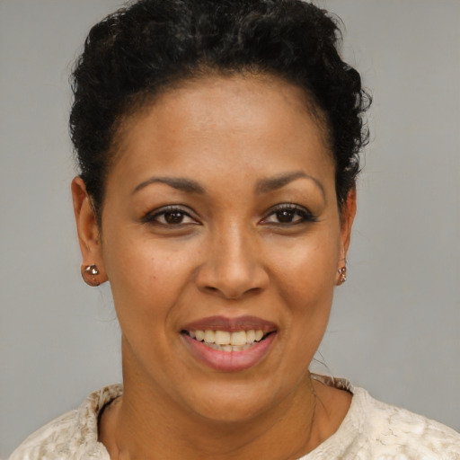 Joyful latino young-adult female with short  brown hair and brown eyes