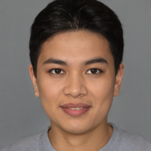 Joyful asian young-adult male with short  brown hair and brown eyes