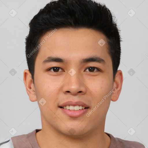 Joyful asian young-adult male with short  brown hair and brown eyes